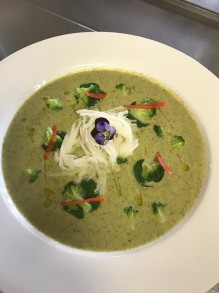 Truffled broccoli soup topped with nasturtium leaves and grand padano cheese